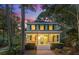Charming two-story home with a inviting front porch, manicured landscaping and an American flag on display at 5032 Coral Reef Dr, Johns Island, SC 29455
