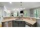 Open kitchen layout with granite countertops, stainless steel dishwasher and sink at 5032 Coral Reef Dr, Johns Island, SC 29455