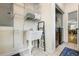 Functional laundry room with a sink, shelving, and convenient access to appliances at 5032 Coral Reef Dr, Johns Island, SC 29455