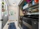 Bright laundry room with modern appliances, a blue rug, and access to the outdoors at 5032 Coral Reef Dr, Johns Island, SC 29455
