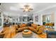 Open concept living room flows into kitchen and dining areas featuring a comfortable sectional couch at 5032 Coral Reef Dr, Johns Island, SC 29455
