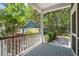 View from the porch overlooking lush landscaping and a detached garage at 5032 Coral Reef Dr, Johns Island, SC 29455