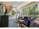 Cozy screened-in porch with comfortable seating, perfect for enjoying the outdoors at 5032 Coral Reef Dr, Johns Island, SC 29455