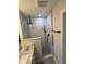 Bright bathroom features modern shower, vanity with marble top, and dark accents at 5445 Ansley Trl, North Charleston, SC 29418