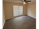 Cozy bedroom featuring plank floors, a ceiling fan, and window with blinds at 5445 Ansley Trl, North Charleston, SC 29418