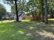 Charming single-Gathering home with manicured lawn, long driveway, fenced-in yard, and desirable curb appeal at 5445 Ansley Trl, North Charleston, SC 29418