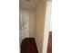 Hallway with hardwood floors and white doors at 5445 Ansley Trl, North Charleston, SC 29418