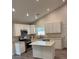 Well-lit kitchen with white cabinets, granite countertops, stainless steel appliances, and a central island at 5445 Ansley Trl, North Charleston, SC 29418