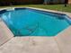 Refreshing in-ground pool with concrete surround, ready for summer fun and relaxation at 5445 Ansley Trl, North Charleston, SC 29418