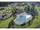 Beautiful aerial view of the community pool and clubhouse in a lush green neighborhood at 578 Mountain Laurel Cir, Goose Creek, SC 29445