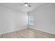 Neutral bedroom showcasing luxury vinyl flooring and a window with blinds at 578 Mountain Laurel Cir, Goose Creek, SC 29445