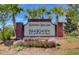 Hayden Hollow Brickhope Plantation community sign surrounded by landscaping and palm trees at 578 Mountain Laurel Cir, Goose Creek, SC 29445