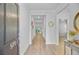 Welcoming entryway with wood-look flooring, neutral walls, and stylish decor, leading to open living spaces at 578 Mountain Laurel Cir, Goose Creek, SC 29445