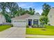 Charming single-story home featuring a manicured lawn, attached two-car garage, and a welcoming front porch at 578 Mountain Laurel Cir, Goose Creek, SC 29445