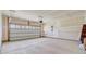 Spacious garage with roll-up door, high ceilings, and ample room for storage or vehicles at 578 Mountain Laurel Cir, Goose Creek, SC 29445