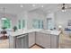 Kitchen island features a stainless steel dishwasher and sink, with an adjacent dining area at 578 Mountain Laurel Cir, Goose Creek, SC 29445