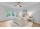 Bright main bedroom with two windows, a ceiling fan, and soft, neutral decor at 578 Mountain Laurel Cir, Goose Creek, SC 29445
