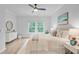 Well-lit main bedroom offers comfort with hardwood floors, a soft rug, and serene decor at 578 Mountain Laurel Cir, Goose Creek, SC 29445