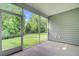 Relaxing screened porch overlooking the lush, green backyard and mature trees at 578 Mountain Laurel Cir, Goose Creek, SC 29445