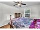 Bedroom featuring hardwood floors, a ceiling fan, and natural light from dual windows, creating a peaceful space at 5806 Robinhood Dr, Hanahan, SC 29410