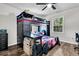bedroom with wood floors, large windows, and a unique bunk bed providing a fun, functional space at 5806 Robinhood Dr, Hanahan, SC 29410