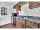 Kitchen with wood cabinets, stainless steel sink, and laminate countertops provides a practical space with a view at 5806 Robinhood Dr, Hanahan, SC 29410