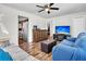 Well-lit living room with wood floors, views into the kitchen and a comfortable seating area at 5806 Robinhood Dr, Hanahan, SC 29410