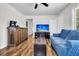 Bright living room with wood-look floors, a comfortable seating area, and access to other rooms at 5806 Robinhood Dr, Hanahan, SC 29410