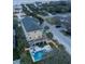 Aerial view of a home featuring a backyard pool, hot tub, deck, and outdoor seating at 601 Ocean Blvd, Isle of Palms, SC 29451