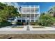 Charming three-story beach house with a beautiful yard and lush landscaping at 601 Ocean Blvd, Isle of Palms, SC 29451