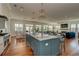 Open-concept kitchen and living space with a large island, ocean views, and modern appliances at 601 Ocean Blvd, Isle of Palms, SC 29451