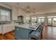 Modern kitchen boasts an island with seating, sleek countertops, and stylish pendant lighting at 601 Ocean Blvd, Isle of Palms, SC 29451