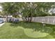 Backyard putting green featuring artificial turf and surrounded by a white picket fence at 601 Ocean Blvd, Isle of Palms, SC 29451