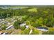 Aerial view of a property with mature trees and nearby lake at 617 Willdrew Ln, Moncks Corner, SC 29461