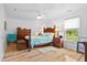 Cozy bedroom with hardwood floors, a decorative wood bed frame, and soft natural light at 617 Willdrew Ln, Moncks Corner, SC 29461
