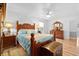 Bedroom features wood furniture including decorative headboard and footboard and light hardwood floors at 617 Willdrew Ln, Moncks Corner, SC 29461