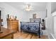Charming bedroom with a metal bed frame, hardwood floors, and ample natural light at 617 Willdrew Ln, Moncks Corner, SC 29461