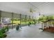 A large covered porch with ceiling fans offering plenty of room to relax and enjoy the views at 617 Willdrew Ln, Moncks Corner, SC 29461