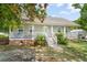 Charming single-story home with a welcoming front porch, well-maintained landscaping, and neutral-toned exterior at 617 Willdrew Ln, Moncks Corner, SC 29461