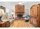 Inviting living room with a brick fireplace, hardwood floors, and comfortable seating, perfect for relaxing and entertaining at 617 Willdrew Ln, Moncks Corner, SC 29461