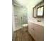 Bathroom featuring a glass shower and vanity with bright white cabinets at 6287 Sniders Hwy, Walterboro, SC 29488