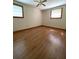 Bedroom featuring hardwood floors, ceiling fan and dual windows at 6287 Sniders Hwy, Walterboro, SC 29488