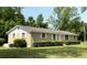 Well-kept single-story brick home with manicured shrubs and a spacious front yard at 6287 Sniders Hwy, Walterboro, SC 29488
