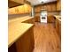Classic kitchen featuring wood cabinetry, laminate counters, and white appliances at 6287 Sniders Hwy, Walterboro, SC 29488