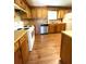 Functional kitchen with wood cabinets, laminate countertops, and white appliances at 6287 Sniders Hwy, Walterboro, SC 29488