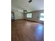 Bright living room with wood-look floors, ceiling fan, and natural light at 6287 Sniders Hwy, Walterboro, SC 29488