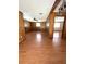 Open-concept living room with wood paneling and hardwood floors at 6287 Sniders Hwy, Walterboro, SC 29488