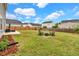 Backyard showcasing a seating area with Adirondack chairs and a fire pit at 716 Mcroy St, Moncks Corner, SC 29461