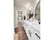 Bathroom featuring double vanity sinks, modern fixtures, and access to a walk-in closet at 716 Mcroy St, Moncks Corner, SC 29461