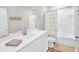 A neutral bathroom featuring white vanity, tile flooring and a shower at 716 Mcroy St, Moncks Corner, SC 29461